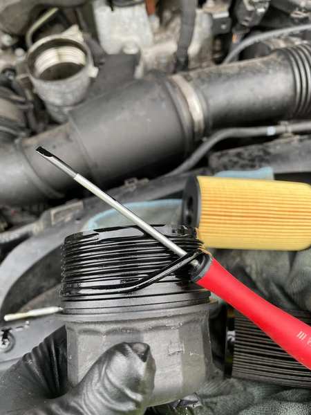 Oil filter removal — cartridge type service